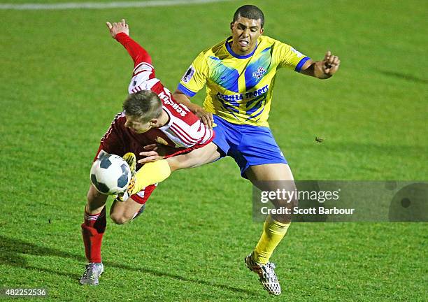 Keenan Duimpies of Brisbane Strikers FC and Marcus Schroen of Hume City FC compete for the ball during the FFA Cup match between Hume City FC and...