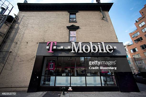 Mobile US Inc. Store stands in New York, U.S., on Sunday, July 26, 2015. T-Mobile US Inc. Is scheduled to release earnings figures on July 30....