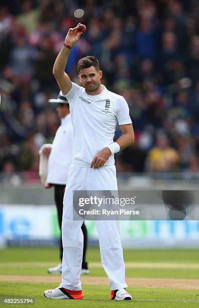 James Anderson of England raises the ball after claiming his fifth wicket during day one of the 3rd Investec Ashes Test match between England and...