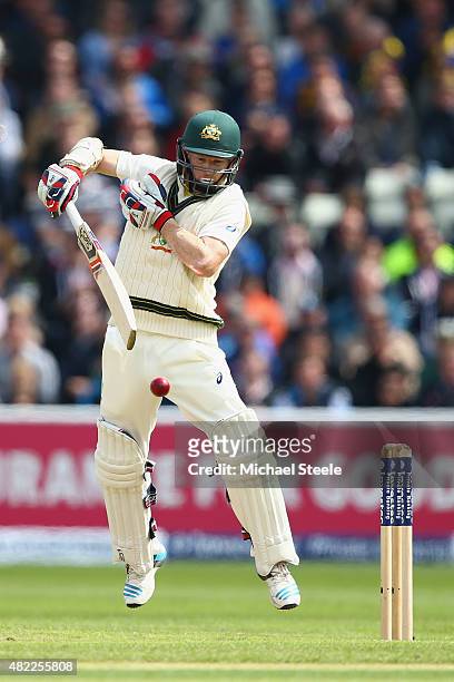 Chris Rogers of Australia fends a rising delivery from Stuart Broad of England during day one of the 3rd Investec Ashes Test match between England...