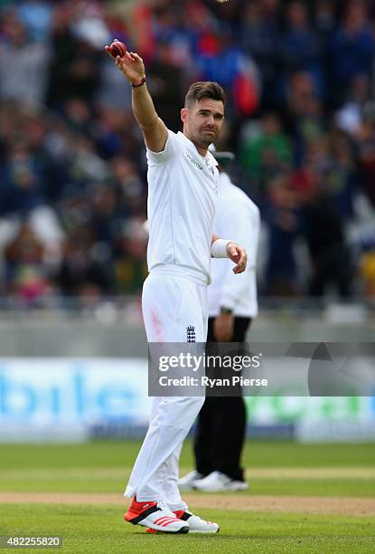 James Anderson of England raises the ball after claiming his fifth wicket during day one of the 3rd Investec Ashes Test match between England and...