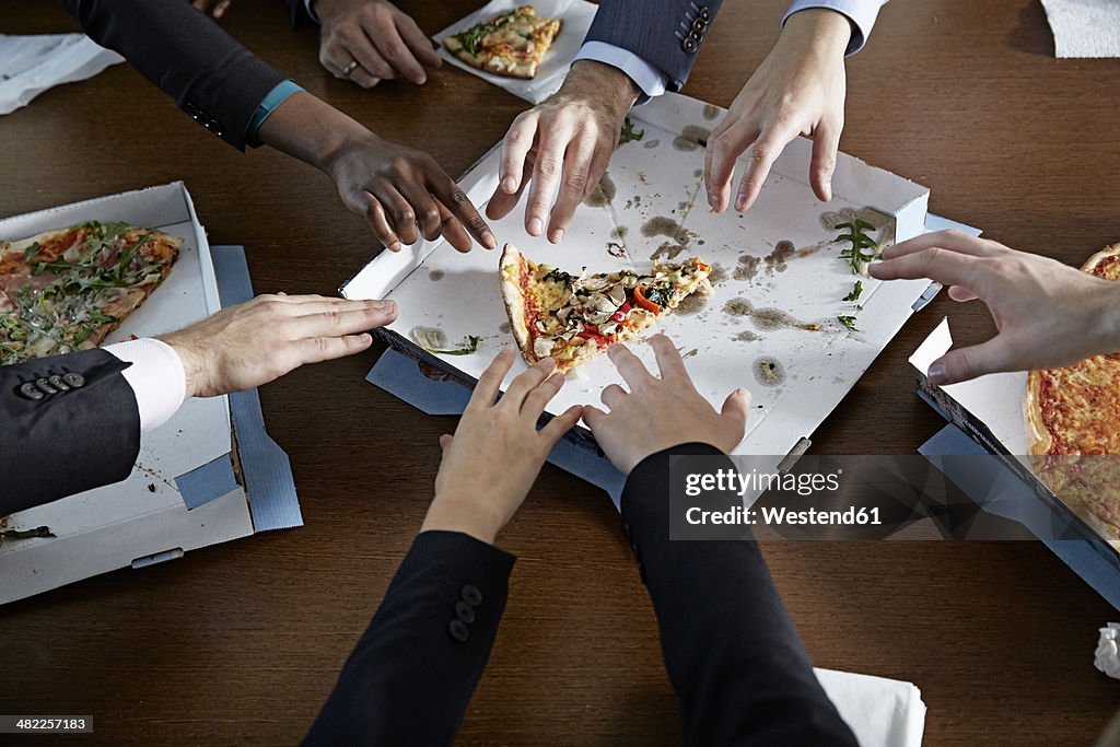 Germnay, Neuss, Hands reaching for pizza