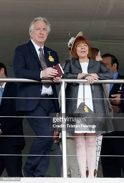Alan Rickman and wife Rima Horton attend on day two of the Qatar Goodwood Festival at Goodwood Racecourse on July 29, 2015 in Chichester, England.