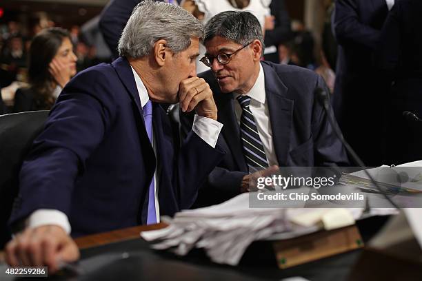 Secretary of State John Kerry and Treasury Secretary Jacob Lew talks during a break from testifying before the Senate Armed Services Committee about...