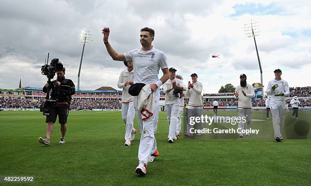 James Anderson of England salutes the crowd as he leaves the field after taking 6 wickets during day one of the 3rd Investec Ashes Test match between...