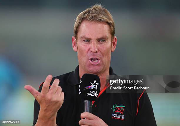 Commentator and former Australian cricketer Shane Warne speaks during the ICC World Twenty20 Bangladesh 2014 1st Semi-Final match between Sri Lanka...