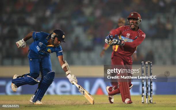 Mahela Jayawardene of Sri Lanka is run out by Darren Sammy of the West Indies, as Denesh Ramdin celebrates during the ICC World Twenty20 Bangladesh...