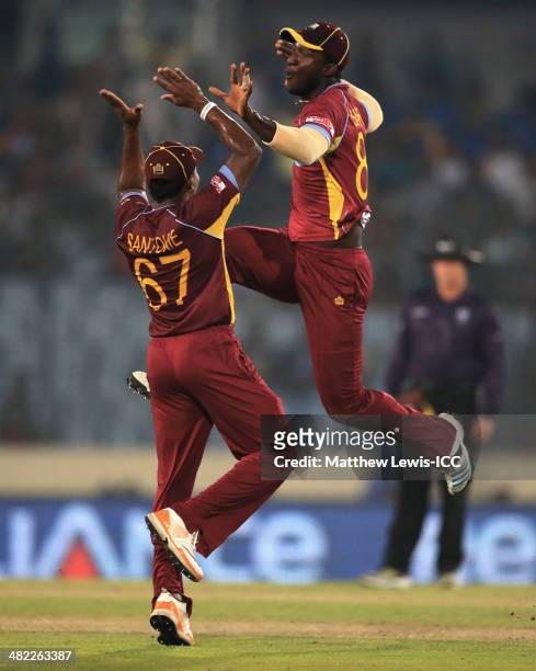 Darren Sammy of the West Indies celebrates with Krishmar Santokie, after running out Mahela Jayawardene of Sri Lanka during the ICC World Twenty20...