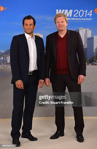 Bayern Muenchen football legends, Hasan Salihamidzic and Oliver Kahn are pictured during the ARD/ZDF FIFA World Cup 2014 team presentation event on...