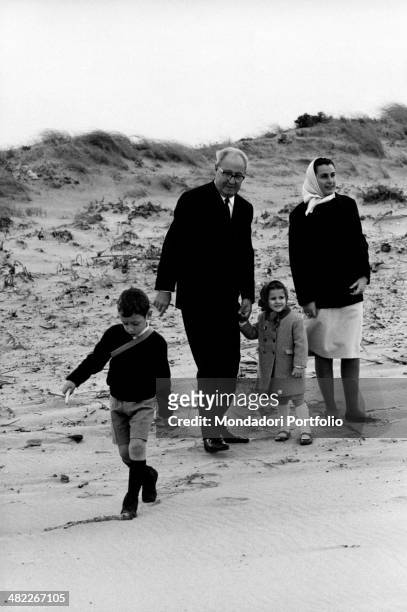 The President of the Italian Republic Giuseppe Saragat holding by the hand his Italian granddaughter Giuseppina Santacatterina. His Italian grandson...