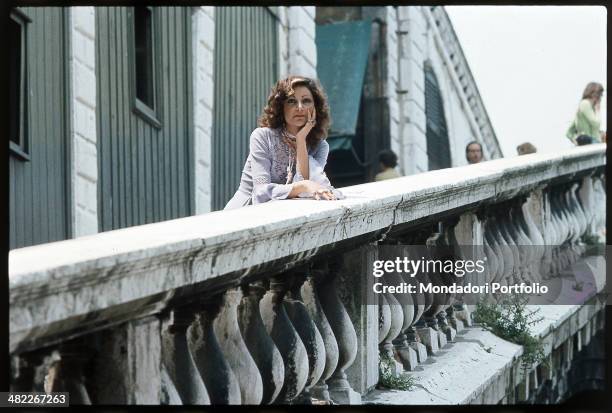 Italian singer Mia Martini leaning on a banister. Mia Martini has just took part in the Mostra Internazionale di Musica Leggera during which she has...