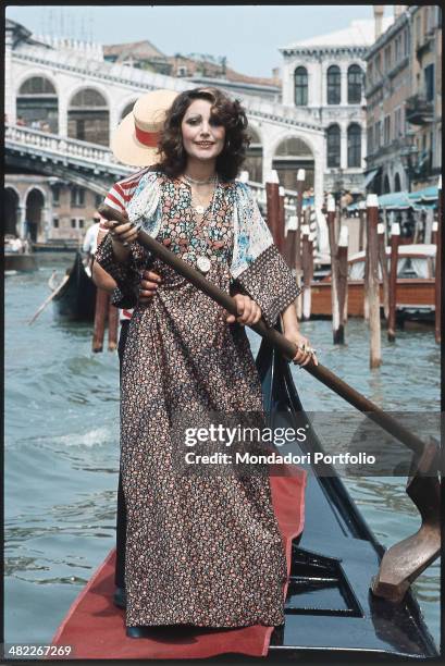 Italian singer Mia Martini rowing on a gondola. Mia Martini has just took part in the Mostra Internazionale di Musica Leggera during which she has...