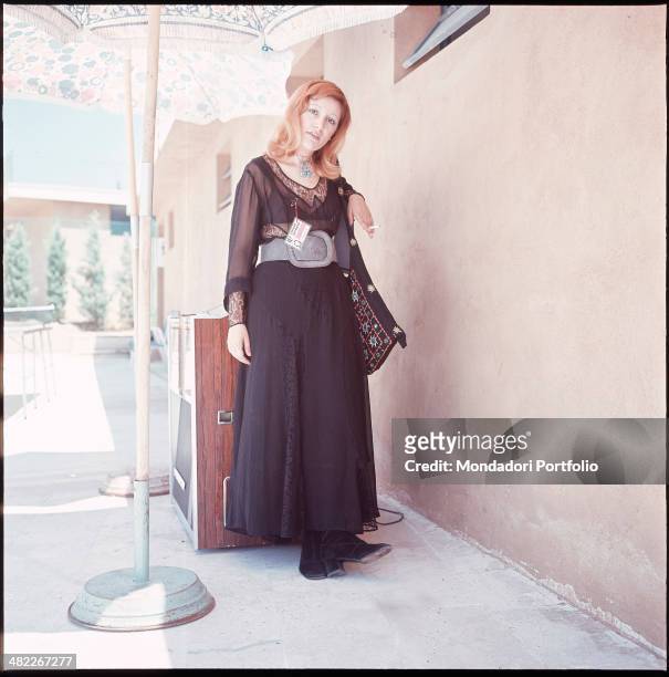 Italian singer Mia Martini smoking a cigarette. 1971