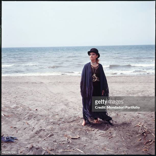 Italian singer Mia Martini posing by the sea. 1971