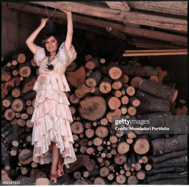 Italian singer Mia Martini posing smiling and with raised arms. 1973