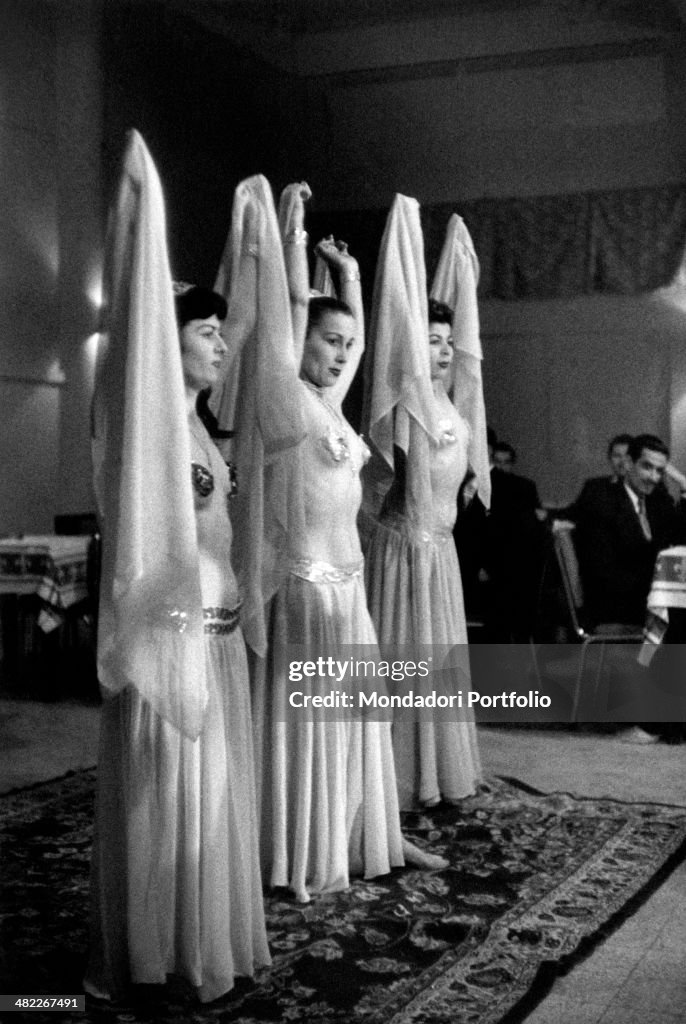 Three belly dancers at a club in Baghdad