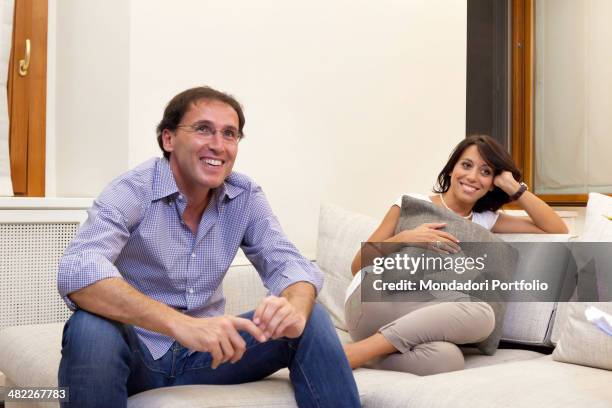 The Italian politician Nunzia De Girolamo smiles sitting on a sofa of her house with her boyfriend, the Italian politician Francesco Boccia. Rome, 29...