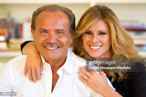 Mauro Masi, italian executive chief of Consap, smiles next his girlfriend and Italian TV presenter Ingrid Muccitelli. July 15, 2011