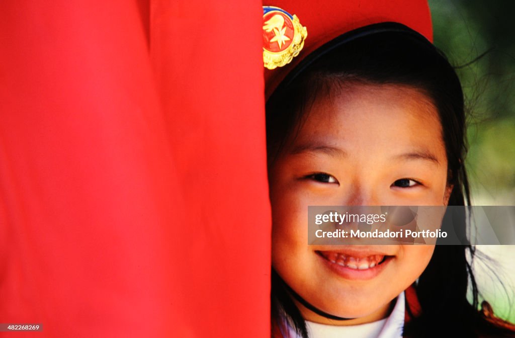 Close-up of a Chinese young girl wearing a red beret