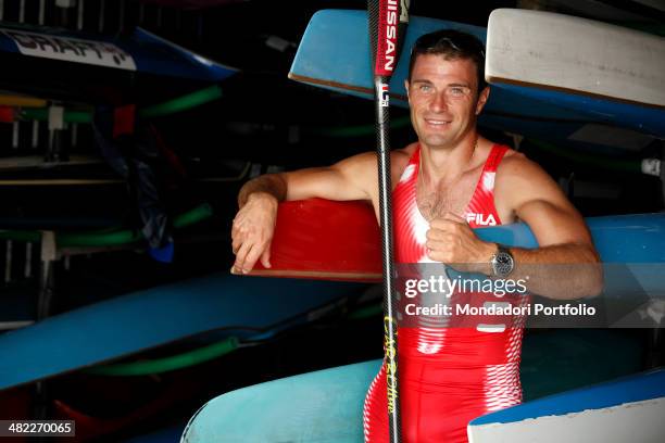 Italian sprint canoer Antonio Rossi, before a training session, poses on the canoes hangar near the lake of Pusiano. Province of Lecco, Italy, 2008.