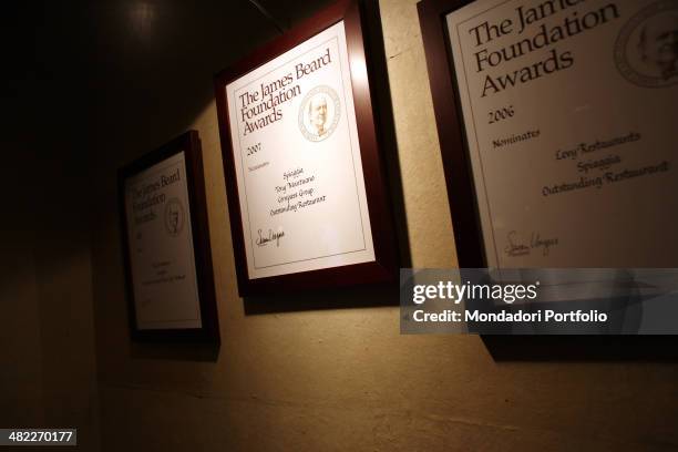 Three framed accolades, hanging from a wall at the restaurant Spiaggia, achieved by the chef Toni Mantuano in 2005, 2006 and 2007; those are The...