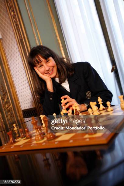 Italian chess champion Marina Brunello poses in front of a chess in a stylish hall at the Centro Congressi of the Industrial Union, in the occasion...