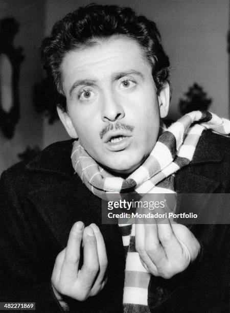 Italian singer-songwriter Domenico Modugno gesticulating. 1959