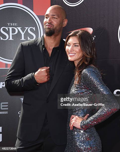 Soccer player Hope Solo and NFL player Jerramy Stevens arrive at The 2015 ESPYS at Microsoft Theater on July 15, 2015 in Los Angeles, California.