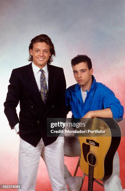 Italian singer-songwriter Eros Ramazzotti posing with the Mexican singer Luis Miguel . Italy, 1985