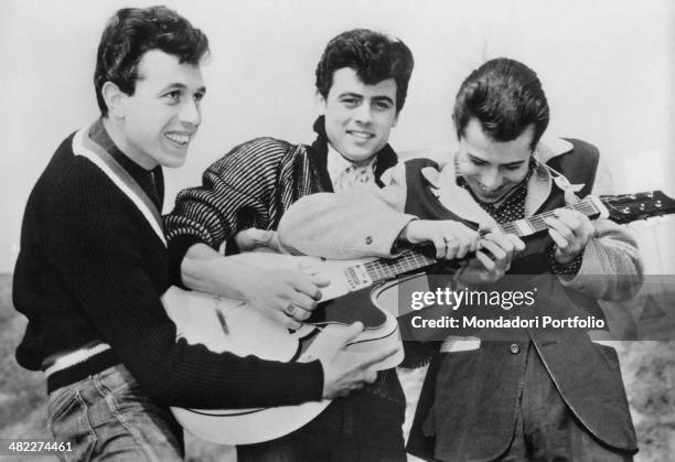 Sammarinese singer Little Tony playing the guitar with the brothers Alberto Ciacci and Enrico Ciacci. They form together the band Little Tony and His...