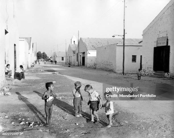 Children playing in a street of Bari. The city knew a building boom and more than a hundred thousand rooms were built up in five years. Bari, 1950s