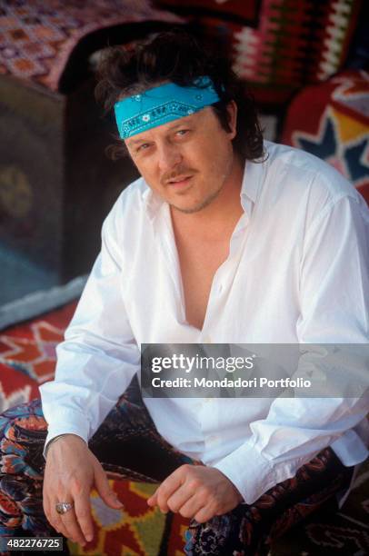 Italian singer-songwriter and musician Zucchero posing wearing a blue bandana. Tunisia, 1999