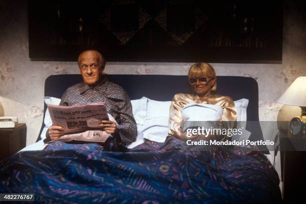 Italian actress and TV presenter Sandra Mondaini in double bed complaining of her boring life with Italian actor and TV host Raimondo Vianello in an...