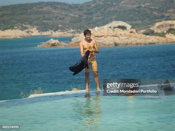 Sammarinese singer Little Tony swimming with Italian actress and model Silvia Dionisio. Porto Cervo, 1968