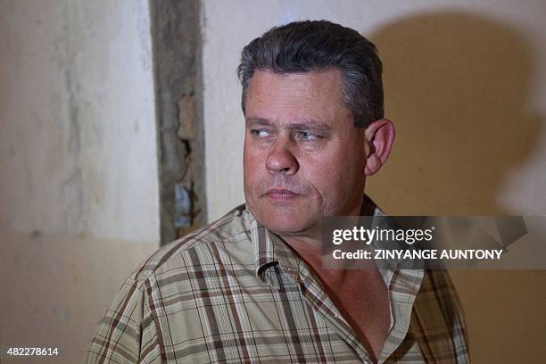 Professional Zimbabwean hunter Theo Bronkhorst leaves the Magistrate's Court in Hwange on July 29 after proceedings on poaching charges. Bronkhorst...