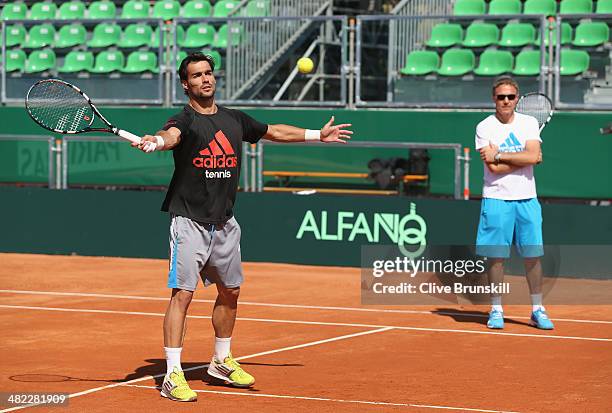 Fabio Fognini of Italy in practices volleys during a practice session prior to the Davis Cup World Group Quarter Final match between Italy and Great...