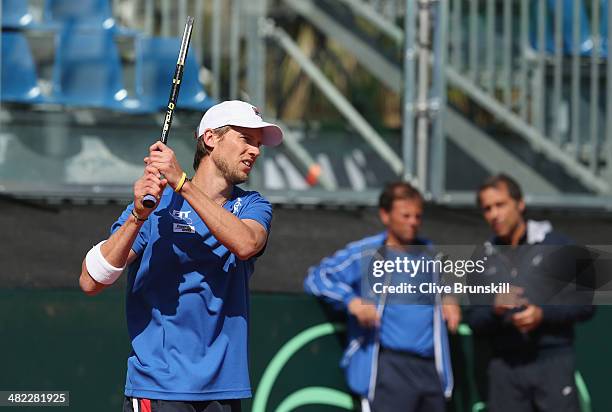 Andreas Seppi of Italy in action watched by Italian coaches during a practice session prior to the Davis Cup World Group Quarter Final match between...