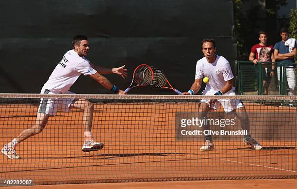 Doubles pairing of Colin Fleming and Ross Hutchins of Great Britain practice after the main draw ceremony prior to the Davis Cup World Group Quarter...