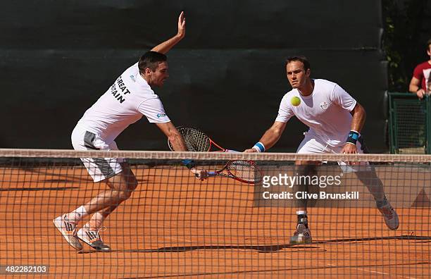Doubles pairing of Colin Fleming and Ross Hutchins of Great Britain practice after the main draw ceremony prior to the Davis Cup World Group Quarter...