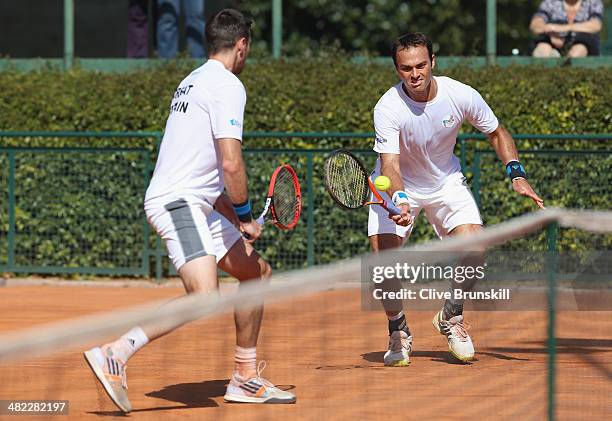 Doubles pairing of Colin Fleming and Ross Hutchins of Great Britain practice after the main draw ceremony prior to the Davis Cup World Group Quarter...