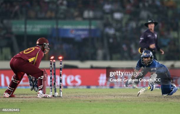 Tillakaratne Dilshan of Sri Lanka is run out during the Sri Lanka v West Indies at Sher-e-Bangla Mirpur Stadium during the ICC World Twenty20...