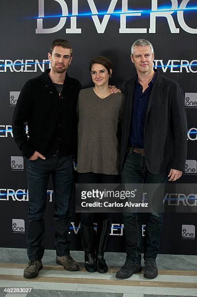 Actor Theo James, actress Shailene Woodley and director Neil Burger attend the "Divergent" photocall at the Villamagna Hotel on April 3, 2014 in...