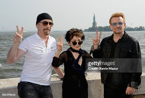 The Edge, Yoko Ono and Bono attend Amnesty International Tapestry Honoring John Lennon Unveiling at Ellis Island on July 29, 2015 in New York City.
