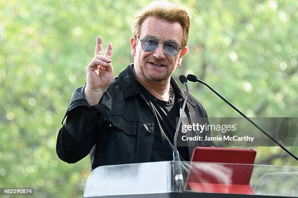 Bono speaks at Amnesty International Tapestry Honoring John Lennon Unveiling at Ellis Island on July 29, 2015 in New York City.