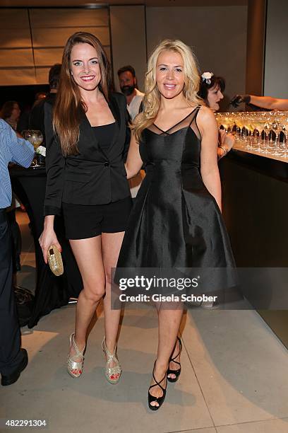 Daniela Vukovic, Davorka Tovilo during the Emporio Armani & Friends event at the Armani Caffe on July 29, 2015 in Munich, Germany.