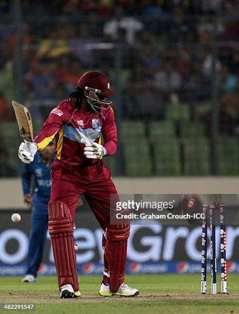 Chris Gayle of West Indies is bowled by Lasith Malinga of Sri Lanka during the Sri Lanka v West Indies at Sher-e-Bangla Mirpur Stadium during the ICC...
