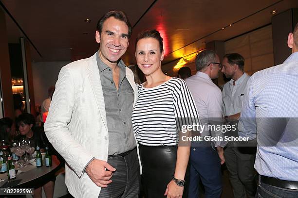 Host Michael Wilhelmer, Nikita Stromberg during the Emporio Armani & Friends event at the Armani Caffe on July 29, 2015 in Munich, Germany.