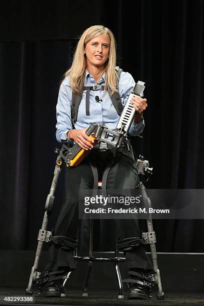 Trish Aelker demonstrates the FORTIS exoskeleton onstage during the "Breakthrough" panel discussion at the National Geographic Channel portion of the...