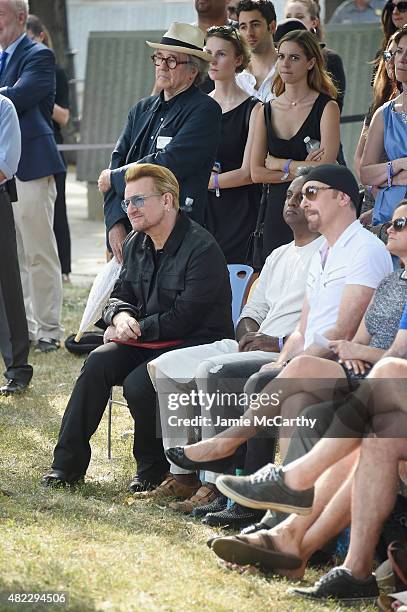 Bono and The Edge of U2 attend Amnesty International Tapestry Honoring John Lennon Unveiling at Ellis Island on July 29, 2015 in New York City.