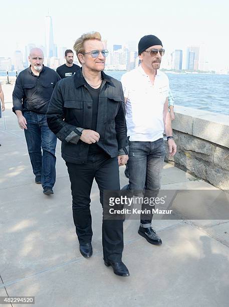 Bono and The Edge of U2 attend Amnesty International Tapestry Honoring John Lennon Unveiling at Ellis Island on July 29, 2015 in New York City.